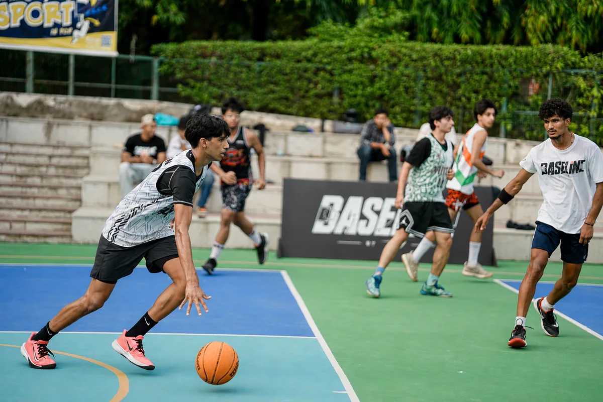 A basketball player protecting the ball against close pressure