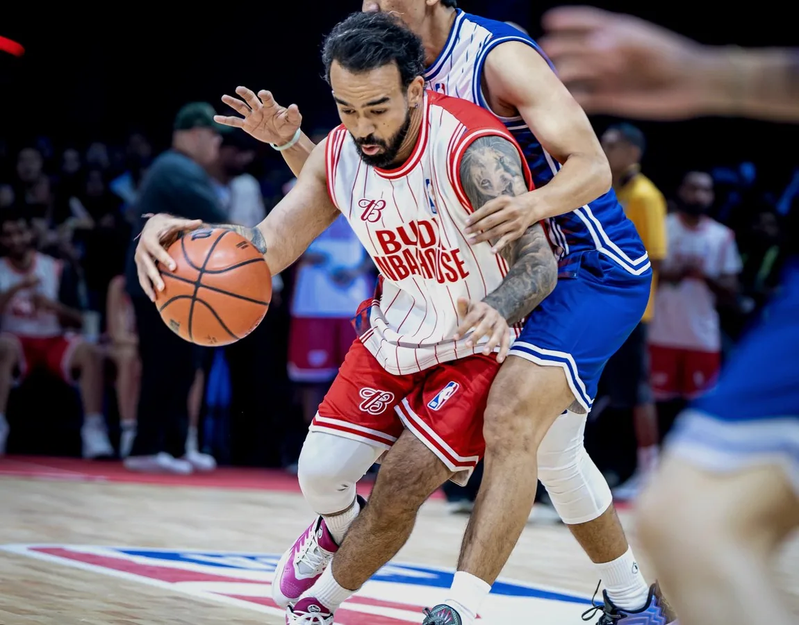 Dhruv Barman competing with the basketball