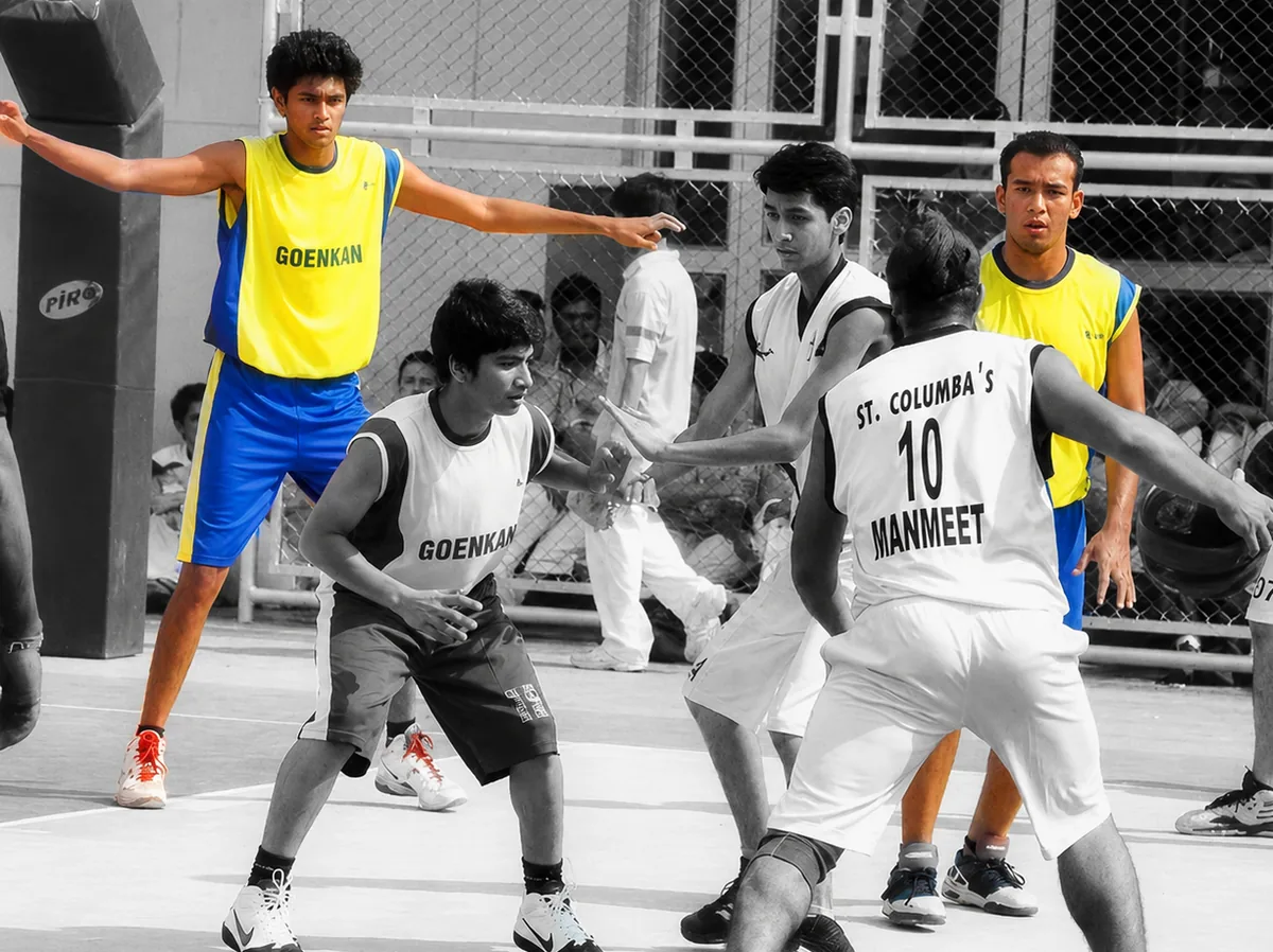 Dhruv Barman and Ragaa Singh playing basketball as students