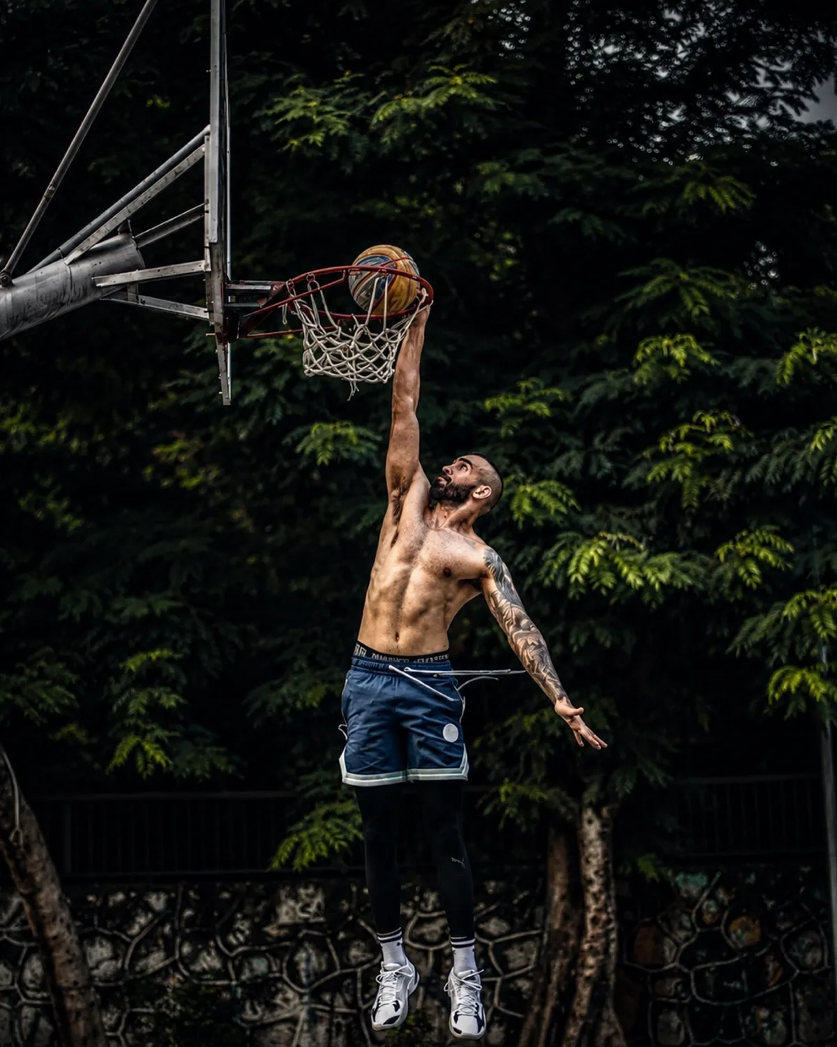 Basketball player finishing at the rim in the Student Hub Flight School Level 1 workout tile