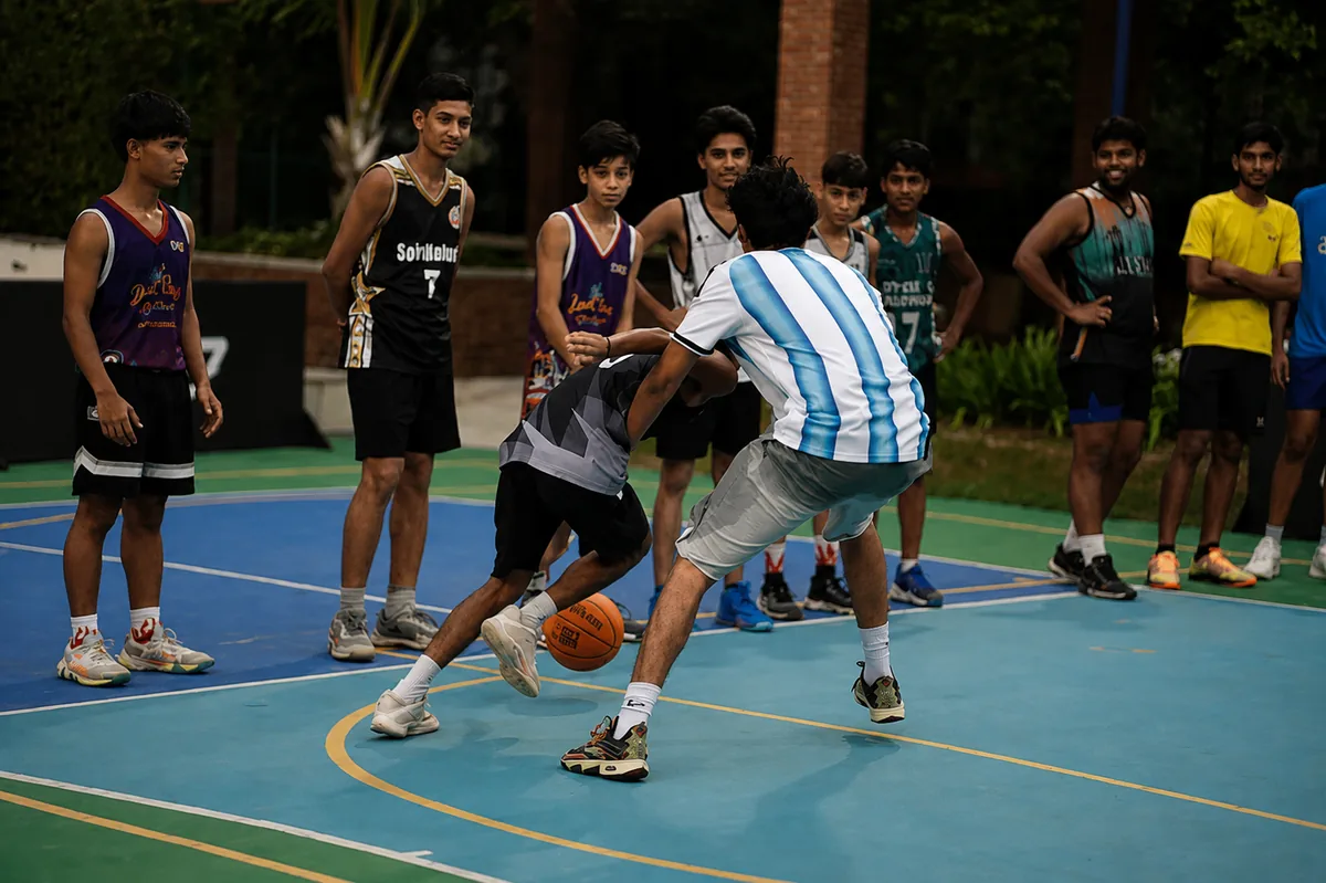 A Baseline athlete controlling the ball while driving past a defender