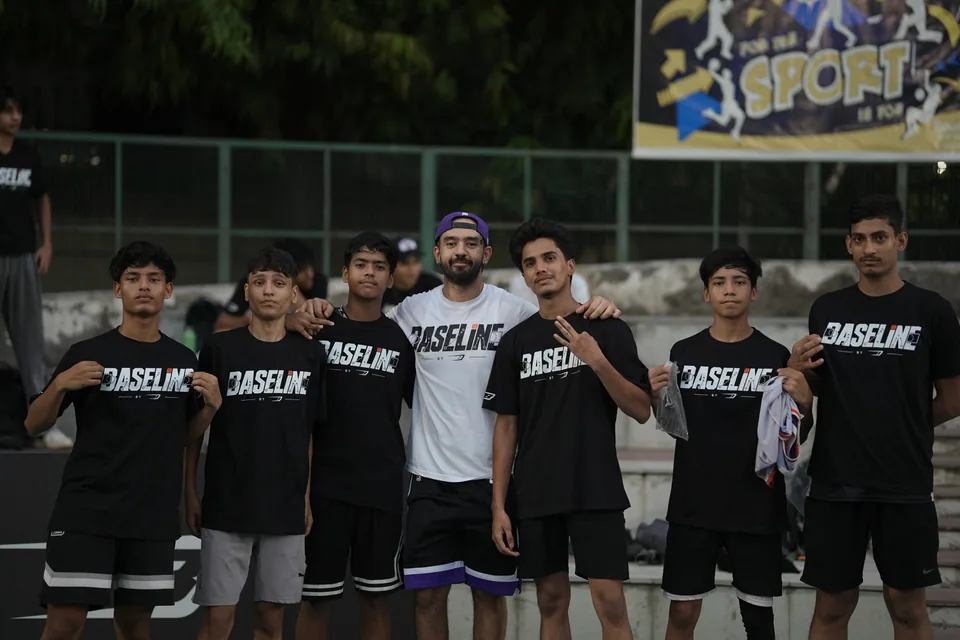 Baseline students and a coach together after training