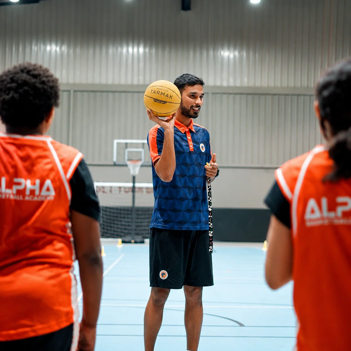 A certified basketball coach leading a clinic